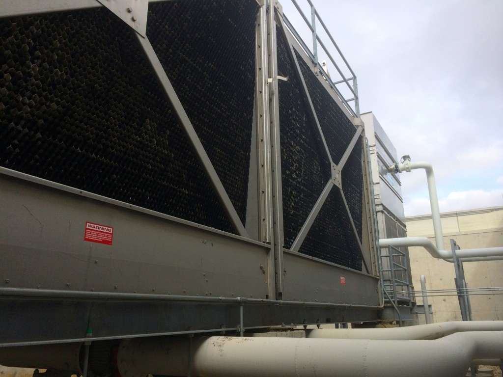 All that heat has to go somewhere, so water gets pumped out to these huge cooling towers outside